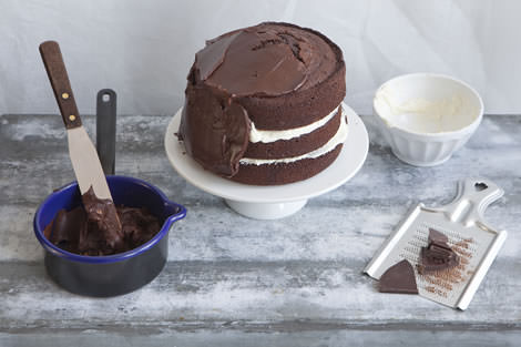 The finishing touches to the chocolate birthday cake